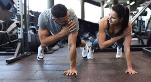 Toning Bingo Wings: Your Ultimate Guide to Sculpting Sleek Arms at the Gym 3 Fitness trainer demonstrating arm toning exercises Greenock