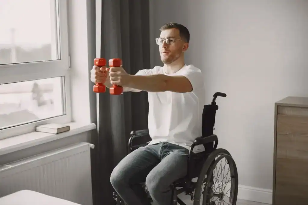 Image of man doing exercise in his wheelchair to aid weight loss Greenock 