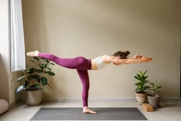 Woman doing Yoga exercise Greenock  to help with toning the body. 
