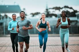 Sculpting Sleek Arms: The Essential Role of Cardio in Toning Without Bulking Up 3 image of people running to incorporate cardio Greenock exercise into their life to help tone arms and body.